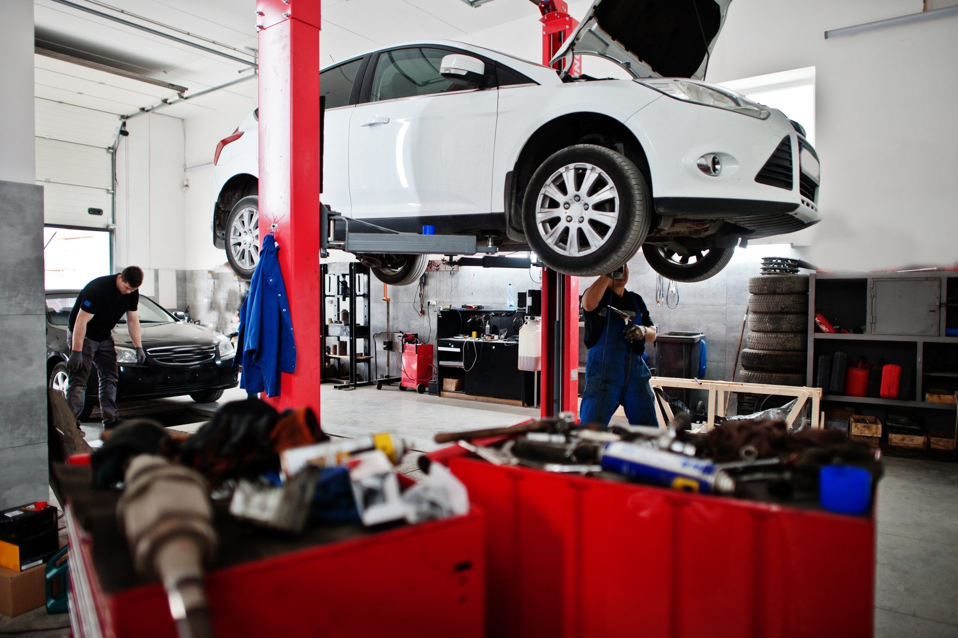 Mechanic working on car engine