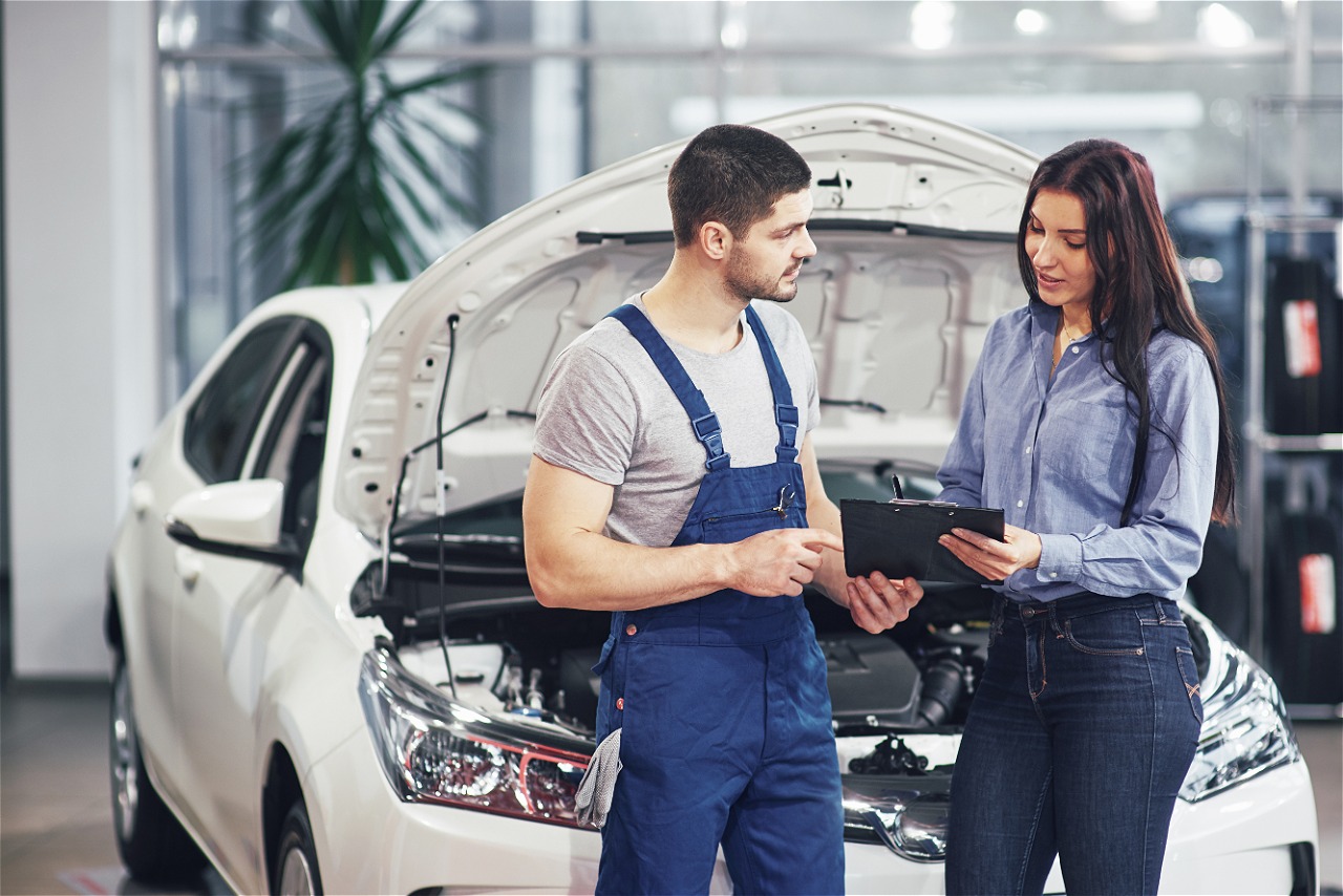 Mechanic working on car engine